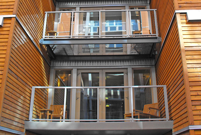 glass component railing on apartment building, Innovative Aluminium Systems