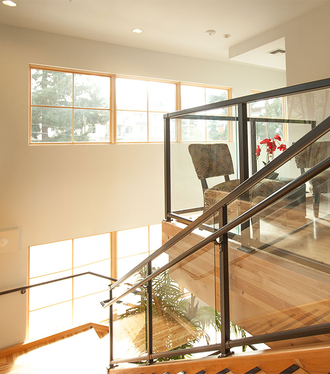 glass component railings inside a house used on a staircase, Innovative Aluminum Systems