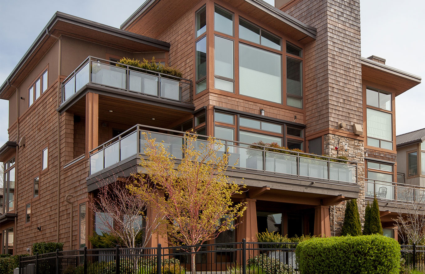 glass component railings use on a deck of a large house, Innovative Aluminum Systems
