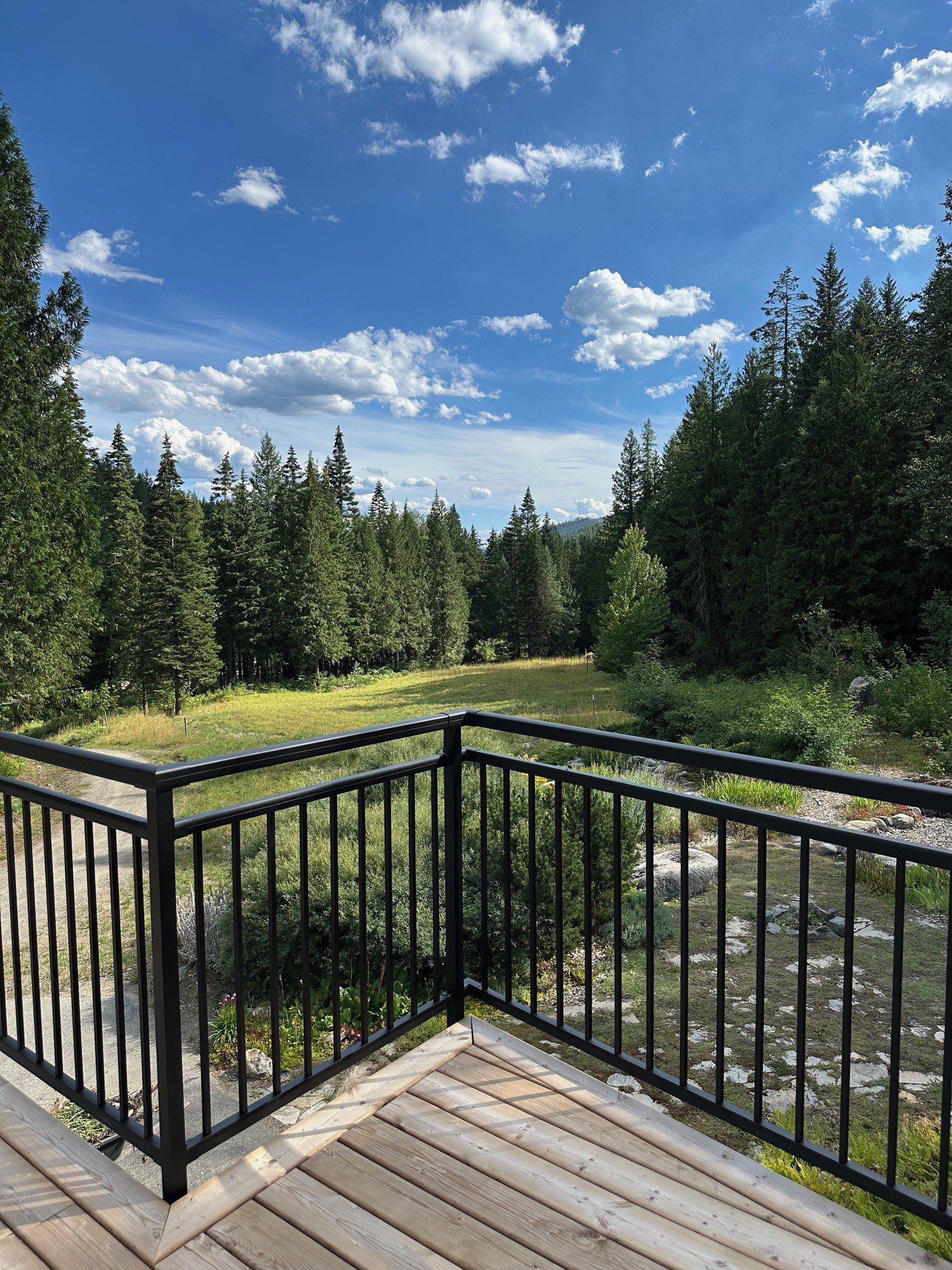 Black powder coated aluminum glass railing system showing modern deck design options